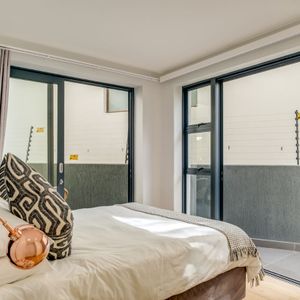 Master bedroom with balcony; APARTMENT ON G - Sea Point