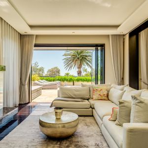 Living room with patio access; VILLA  AUBURN - Camps Bay