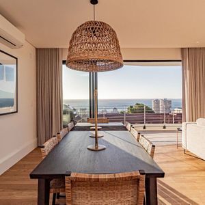 Indoor dining area with view; SUNSHINE POINT - Sea Point