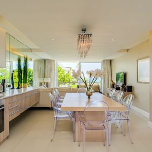 Dining and kitchen; AMANI VILLA - Mouille Point