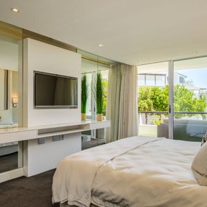 Master bedroom with balcony access; AMANI VILLA - Mouille Point